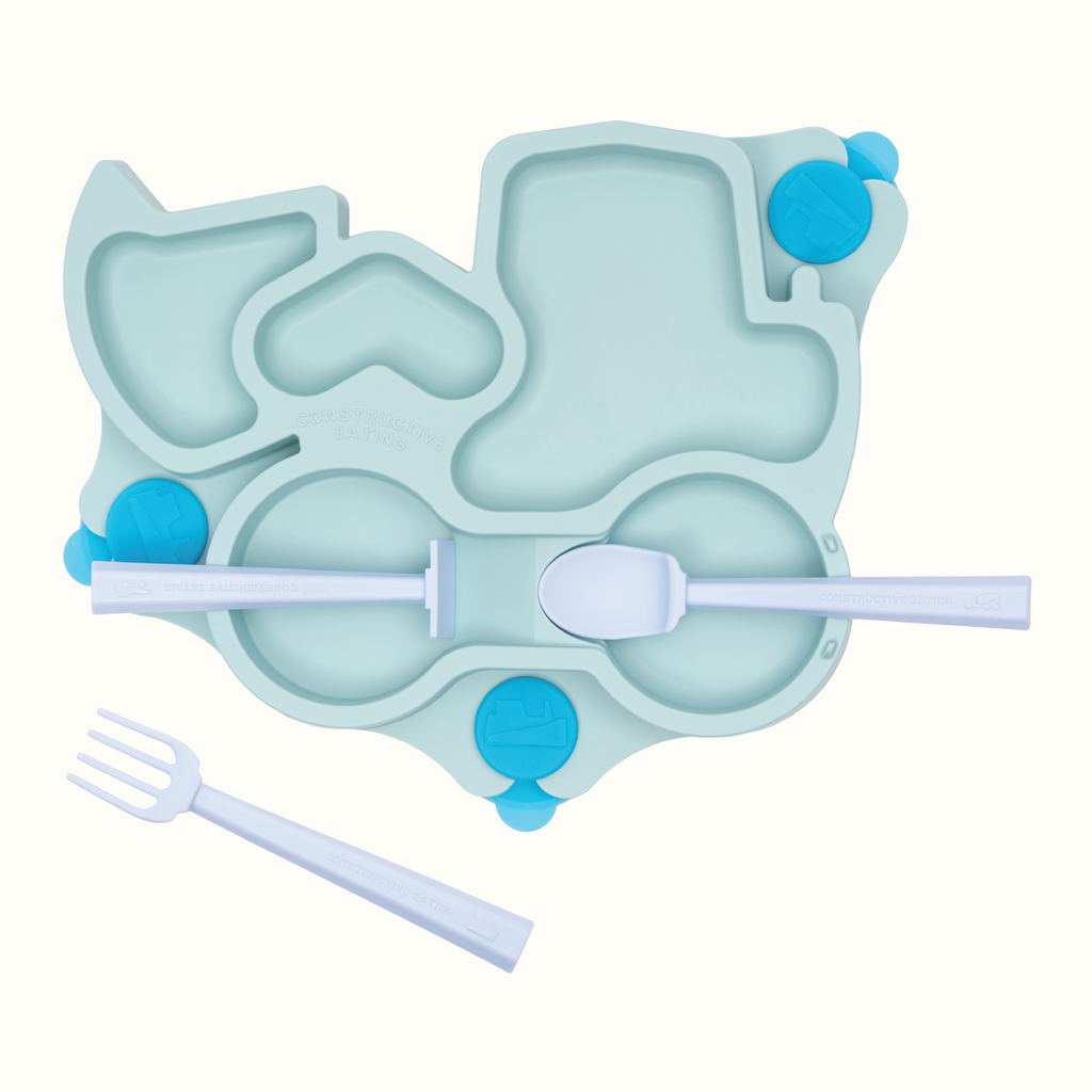 Image of the teal Truck Training Plate and Utensils. The utensils are blue. The pusher and spoon are located on their designated spots on the plate and the fork is in front of the plate.