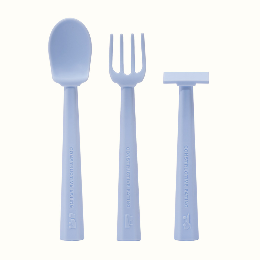 Image of the blue training utensils. The utensils included are a pusher, fork, and spoon.