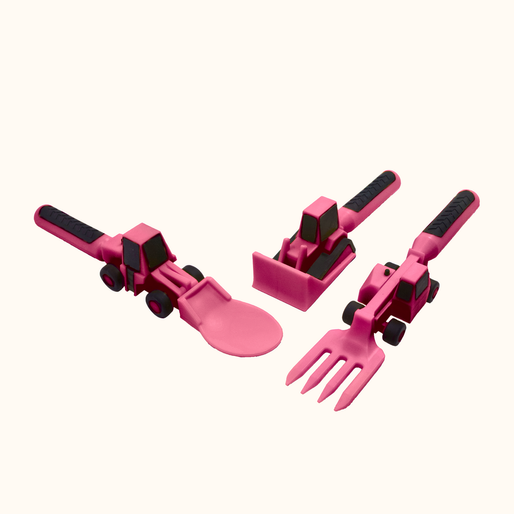 Image of the pink Construction Utensils at an angle. The pink utensils include a bull dozer pusher, a fork lift fork, and a front loader spoon.